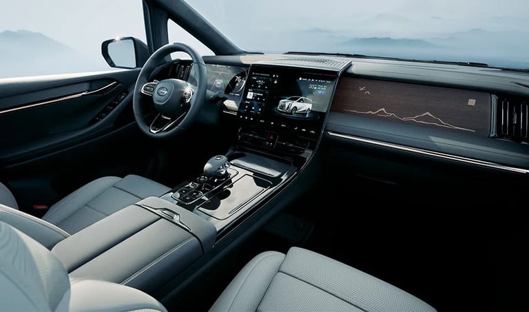 Modern luxury car interior with light gray leather seats, steering wheel, digital dashboard displays, and mountain landscape visible through windshield